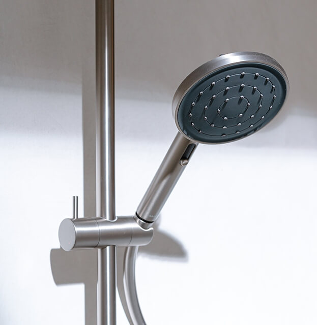 Caroma showerhead highlighting water-efficient Caroma bathroom products by Quality Bathroom Renos.