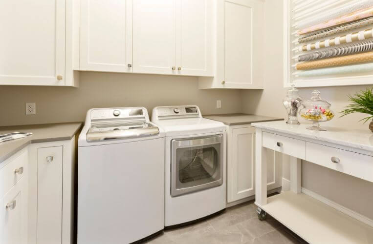 Elegant small laundry renovations in Hornsby by Quality Bathroom Renos blending functionality with stylish white cabinetry.