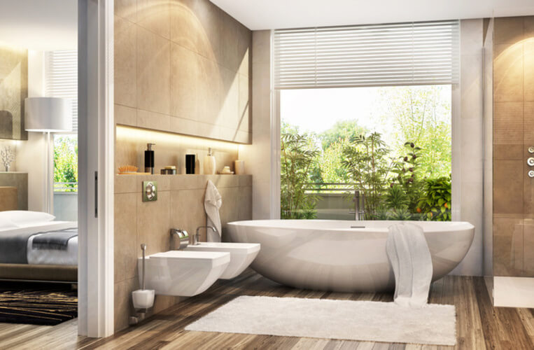 Ensuite bathroom remodel in Hornsby by Quality Bathroom Renos with a clean, modern look, timber floors, and a statement bathtub.
