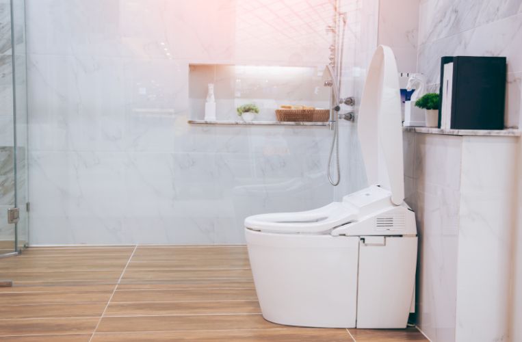 Modern small toilet renovation in Wollongong by Quality Bathroom Renos featuring minimalist design and innovative toilet technology.